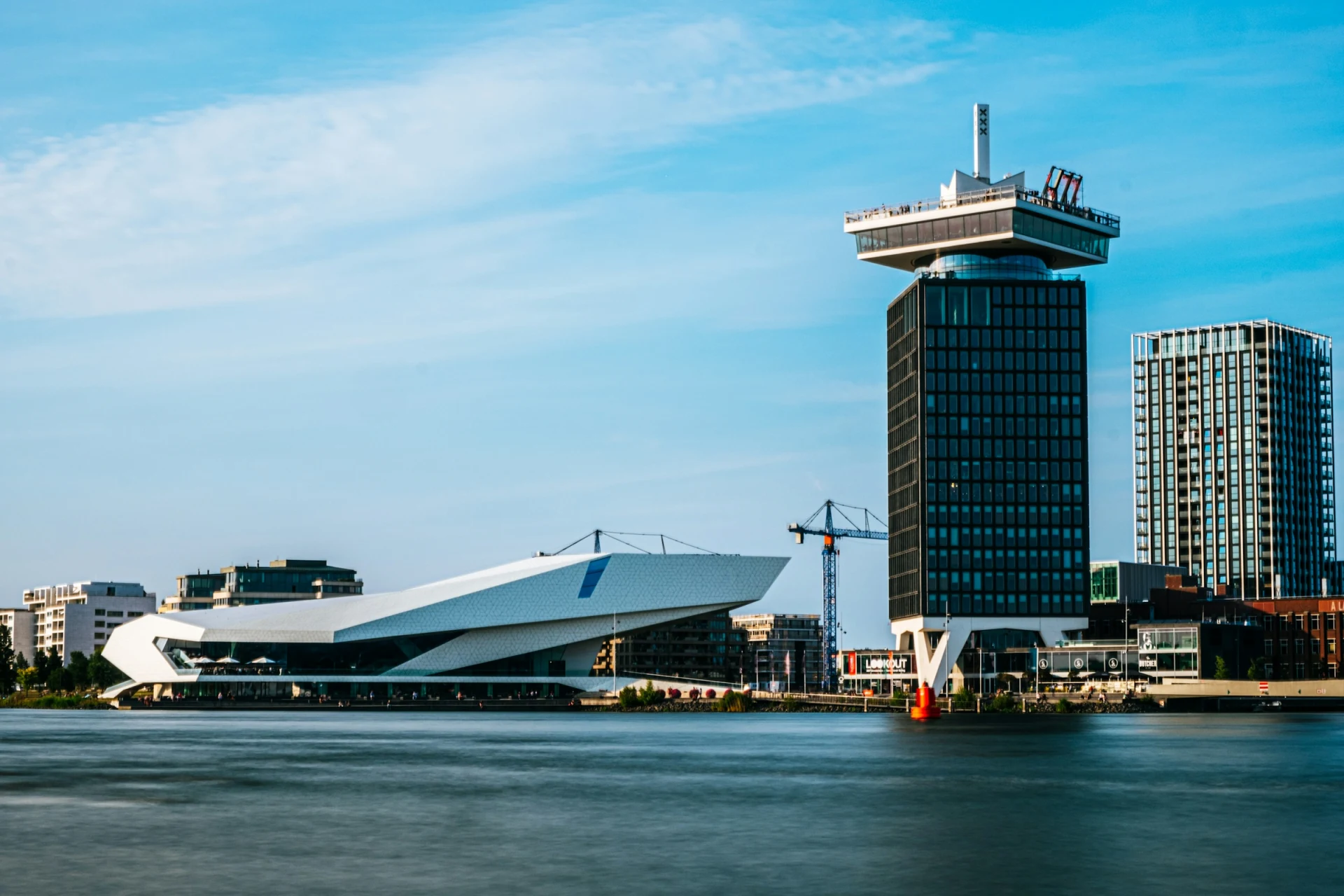 The A'DAM Tower and Amsterdam skyline seen across the IJ waterfront
