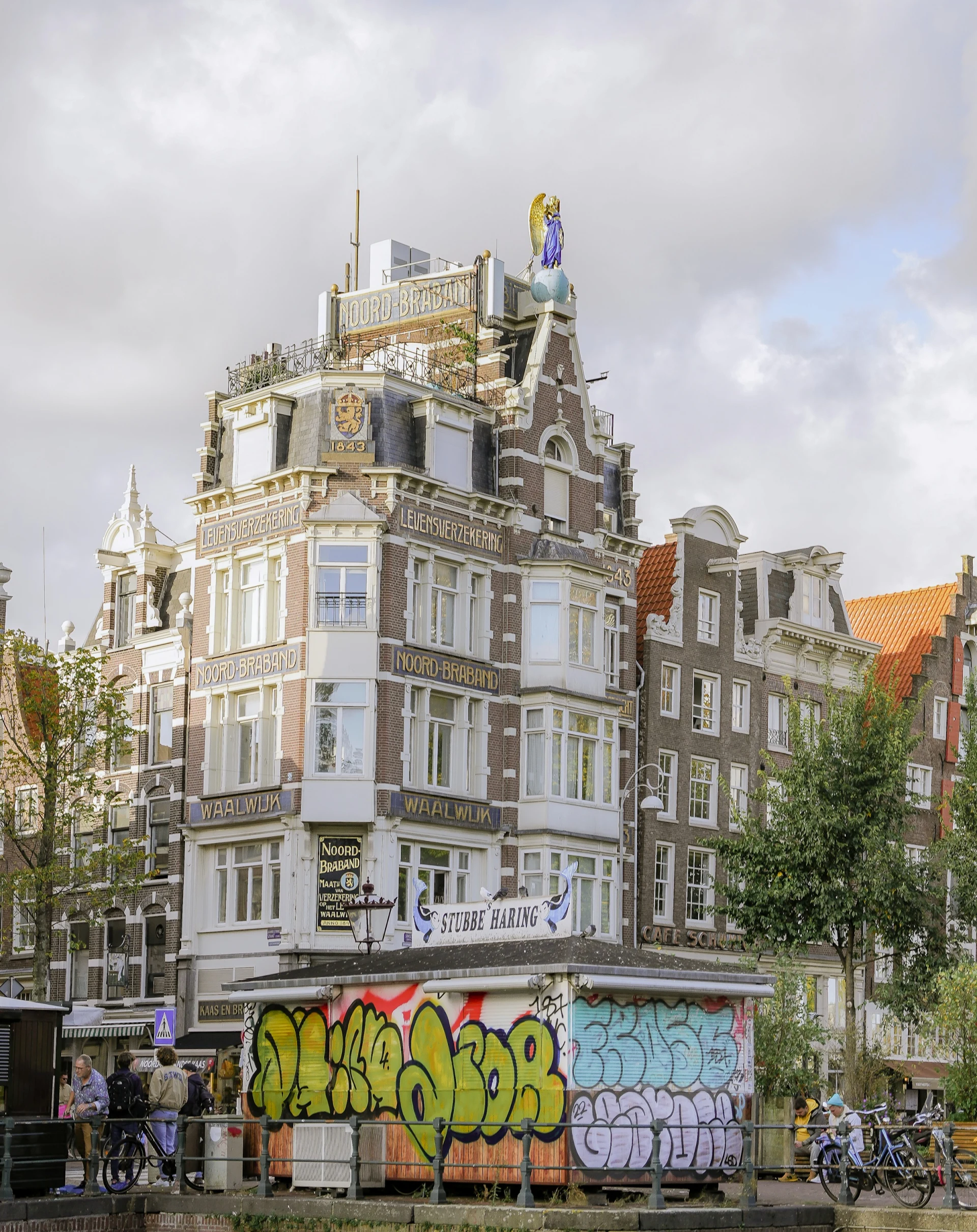 A colourful graffiti-covered building at NDSM Wharf