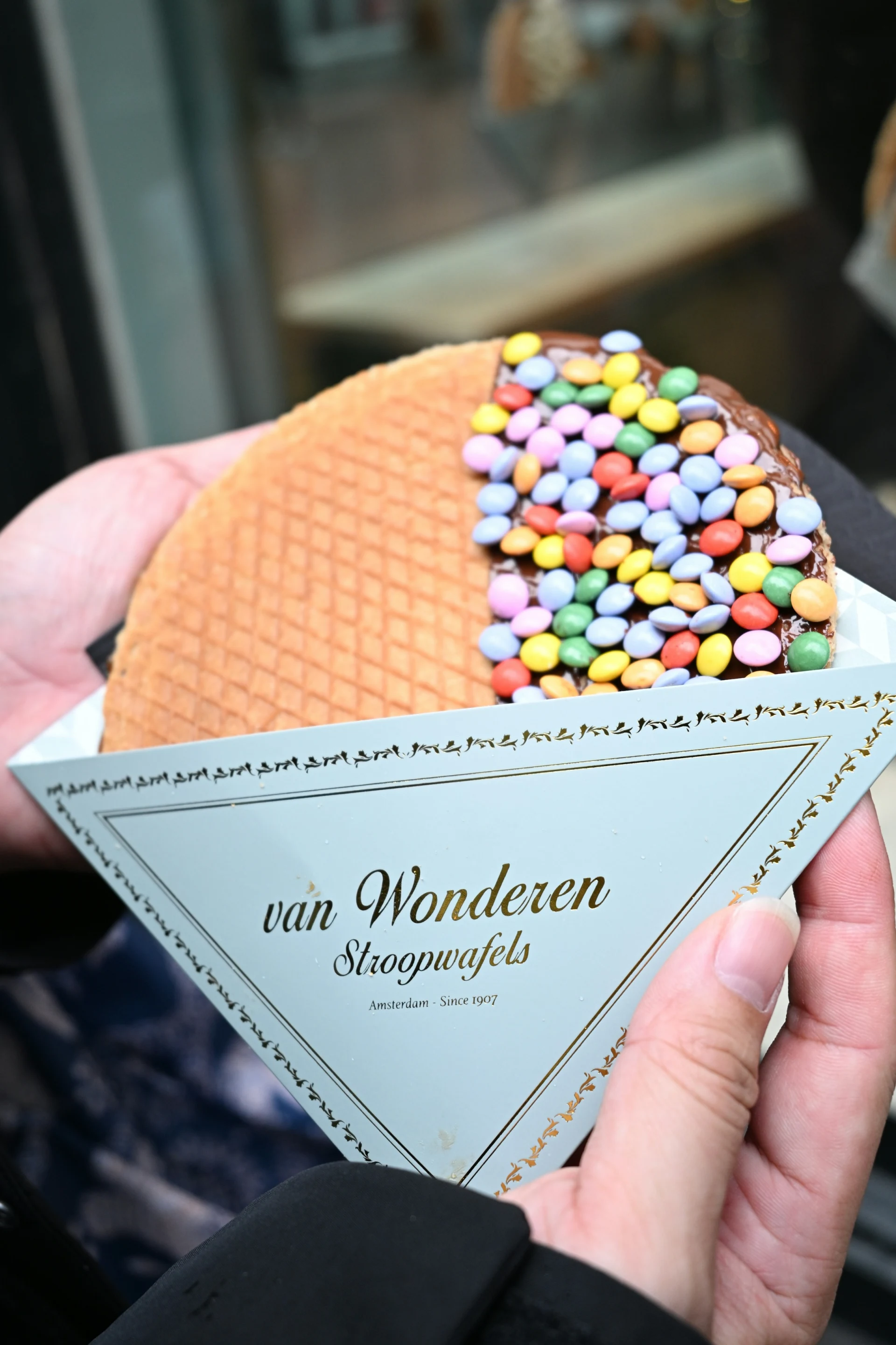 A fresh stroopwafel topped with colourful candy