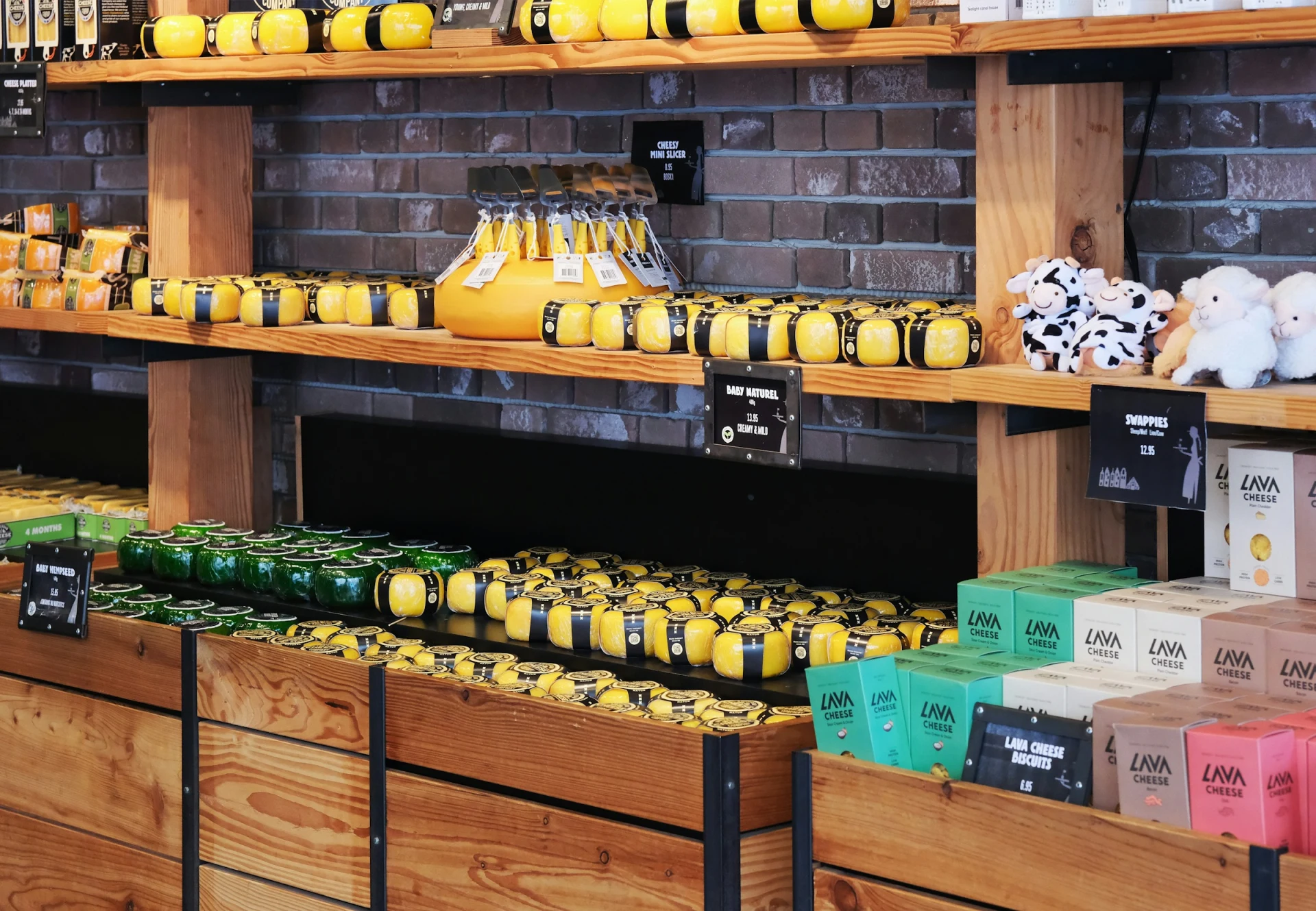 Wheels of Dutch cheese on display at a market stall