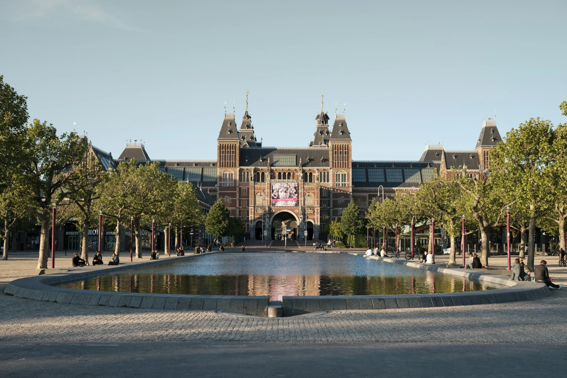 The Rijksmuseum facade and reflecting pool on the Museumplein